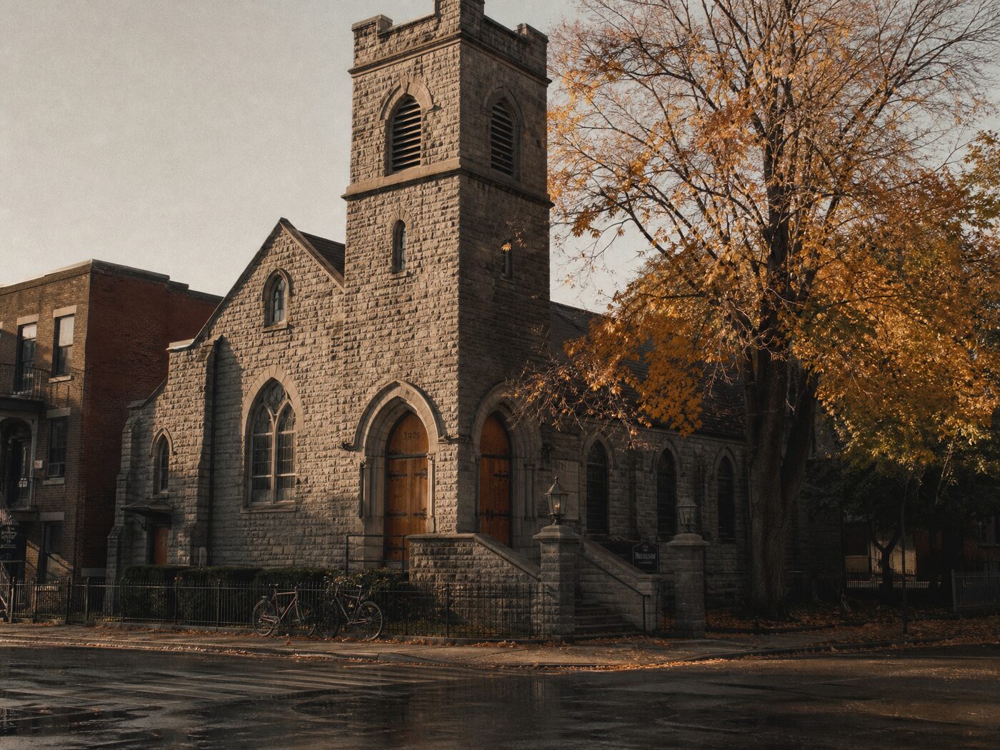 A stone church building on a street corner